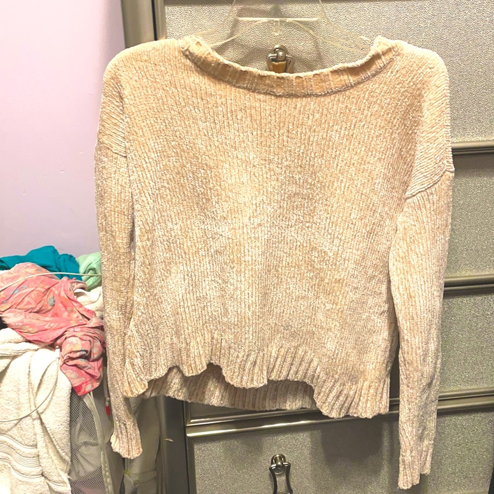Cream colored sweater with a sparkle to it
